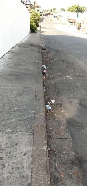 The same kind of street after a cleanup, with the pavement and gutter cleared